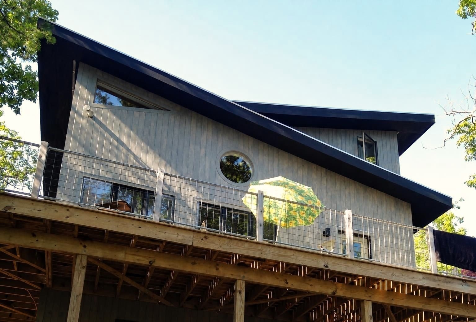Rear elevation — butterfly roof and wrap-around deck