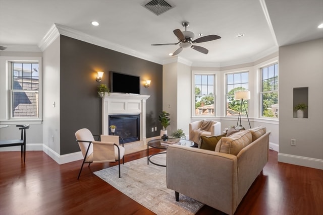 Living room with fireplace and bay windows